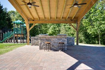 Outdoor lounge with grills, firepit, and wifi